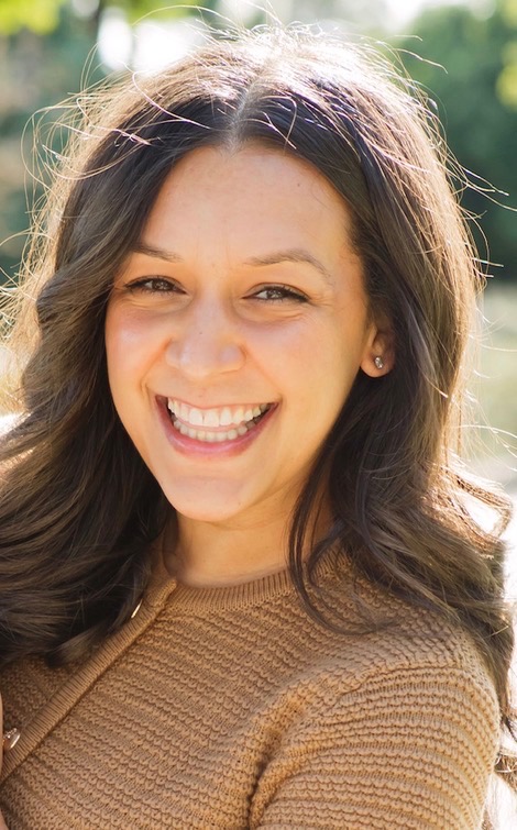Katie Hay, Certified Sleep Consultant, smiling outdoors
